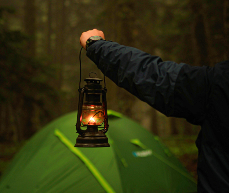 Let there be light!
Don’t forget, it will be much darker during the winter months, with the sun setting as early as 4 o’clock! 
With this in mind, ensure you arrive at your camping site with plenty of time to put your tent up during daylight. You also need to ensure you aren’t left in the dark by a lack of lighting. To keep safe, take lanterns and torches, including plenty of spare batteries. A head torch is perfect for keeping hands-free while lighting your way!
We have a camping light buying guide to help you find the best one for your trip.
