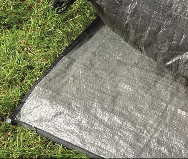 Use a footprint or groundsheet
Using a tent footprint or groundsheet is always a good idea at any time of year, but particularly when it is wet outside!
Lay one down on the ground and pitch your tent on top of it to help keep your tent floor dry. It will also stop the bottom of your tent from becoming muddy. 
It’s also a good idea to put one inside your tent if you want added protection – or use a piece of tarpaulin.
