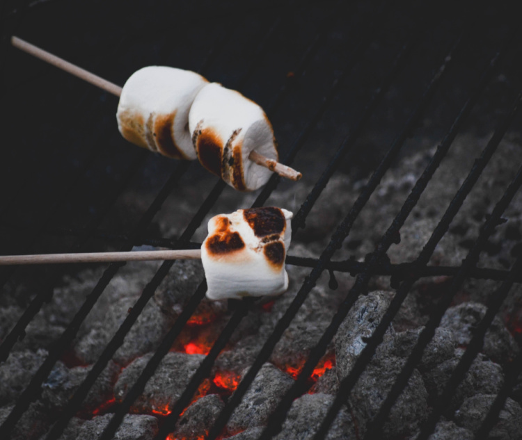 Lastly, here’s one that the kids will love. A modern twist on s’mores around the campfire – why not try s’more nachos on the grill? And the great thing is, this dessert will also take 15 minutes (or less) to complete. 
That’s right. All you’ll need is access to a camping grill and the relevant ingredients. These include: 

A disposable aluminium tray for grilling. 
Digestive or rich tea biscuits. 
Milk chocolate of your choice.
Marshmallows, of course!

