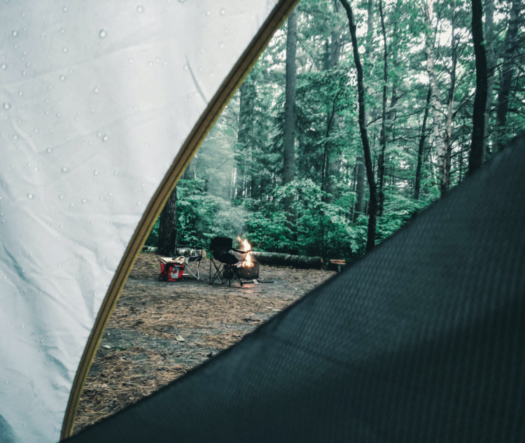 
Pitch your tent: We highly recommend doing this before your camping trip, but we are well aware that this sometimes isn’t possible. You may be able to get away with going through this process on your camping holiday.
Go through the ‘wetting’ process: Leave your tent out in a light rain shower or soak it yourself with a hose for around 10 minutes.
Let your tent dry: This is where the magic happens. During the drying process, the thread within the stitch holes expands and completely fills any space or exposure where water could potentially get through.
Pack your tent away: This is the weathering done and dusted. This shouldn’t need to be done again, throughout the rest of your tents life.
We always recommend using tent waterproofing products on your tent, every 2-3 years which will keep the fabric performing to the best of its ability.

Hopefully, you now know a lot more about polycotton tents than you before. Check out our full range today for exclusives from the biggest camping brands.
