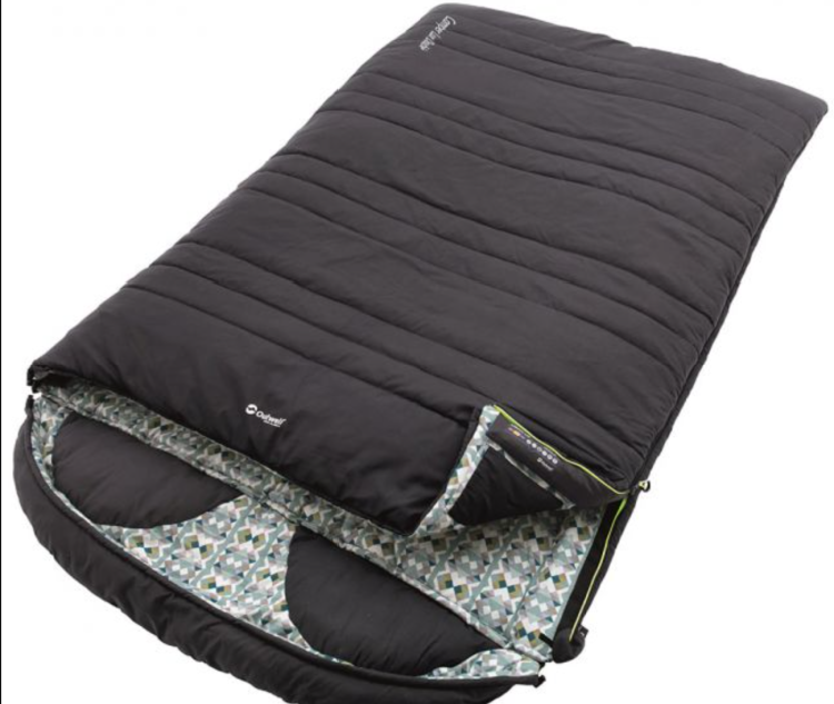 Outwell Camper Lux Double Sleeping Bag
A true favourite for family campers and couples alike, we have the Outwell Camper Lux Double Sleeping Bag.
The Outwell Camper features a polycotton outer, patterned soft lining and Isofill insulation – perfect for those looking for undisturbed rest on an outdoor holiday.
What’s more, this stylish double sleeping bag option also features built-in pillows and a zip-off hood – ensuring unparalleled comfort, whilst also being very useful when separated into two single bags.
Discover more about the Outwell Camper Lux Double Sleeping Bag.
