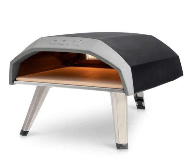 Pizza ovens
Ooni Koda 12 Gas Powered Pizza Oven
It’s safe to say that the Ooni Koda 12 Gas Powered Pizza Oven makes cooking outdoors easier than ever. 
Simply unfold the legs and insert the baking board (using the gas regulator provided to connect to a gas tank) and you’re ready to start creating the most delicious meals – alfresco style!  
This superb portable pizza oven reaches scorching temperatures of 500℃ in just 15 minutes, thanks to the sophisticated instant gas ignition. Plus, this pizza oven comes with a heat control dial so that you can control the temperature to cook pretty much any meal you like. 
